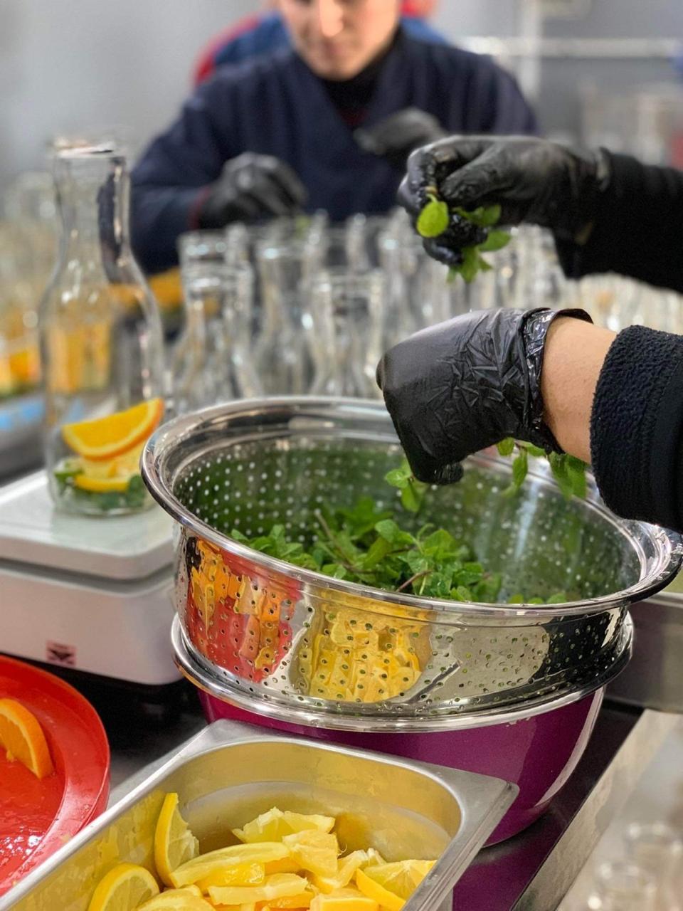 Hand-prepared mint and citrus in the Fruite Voyage production kitchen