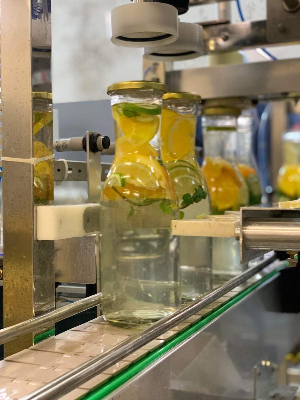 Mojito compote bottles on the filling line